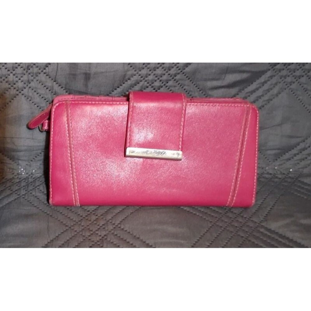 Pink wallet with lots of slots for cards, checkbook or daily planner, a pen, ids